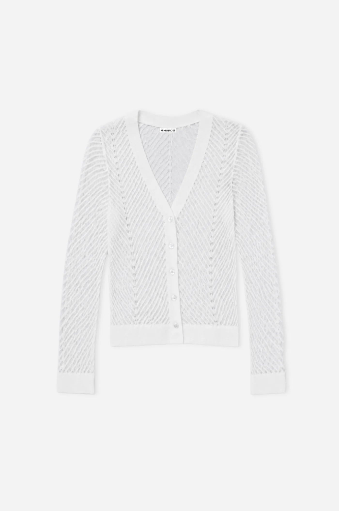 White textured cardigan on a light gray background