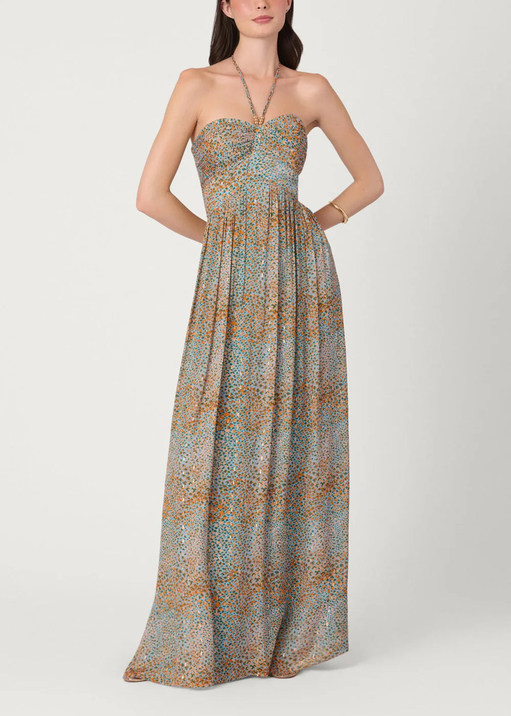 Woman wearing a strapless floral dress on a white background