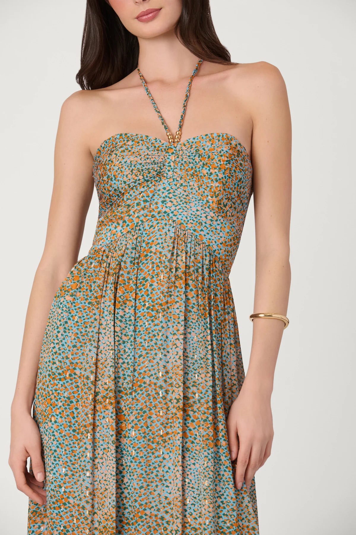 Woman wearing a strapless floral dress on a white background