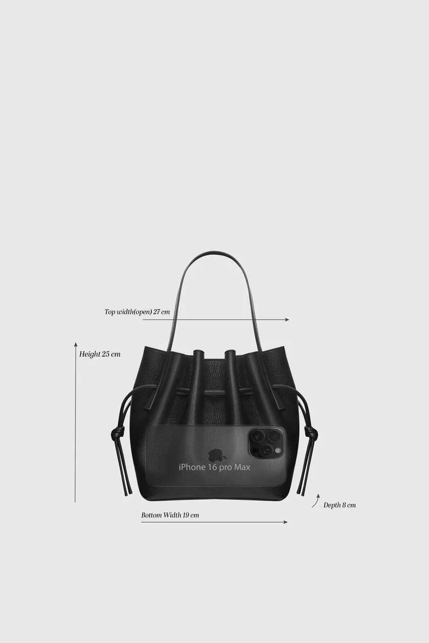 Black handbag with measurements on a light gray background