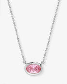 Necklace with a pink gemstone pendant on a white background