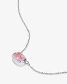Necklace with a pink gemstone pendant on a white background