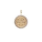 Gold pendant with butterfly design on a white background