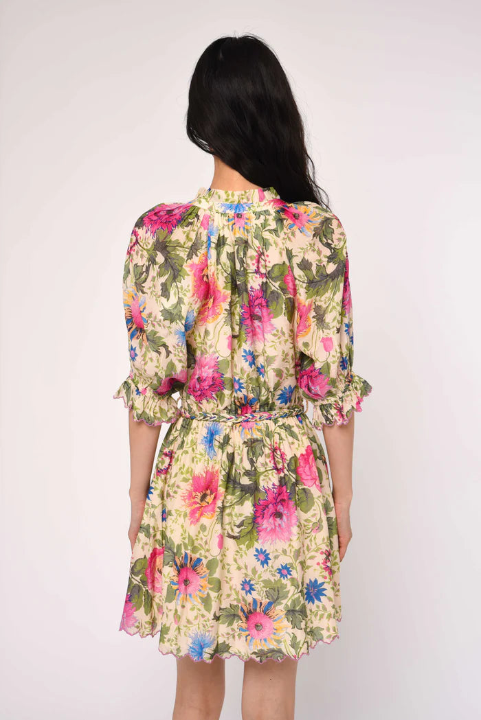 Woman wearing a floral dress with a white background