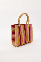 Woven handbag with red and gold stripes on a white background