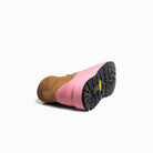 Brown boot with pink sole on a white background