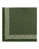 A dark green square scarf with a repeating small white geometric pattern and a decorative border, folded into a square shape on a plain white background.