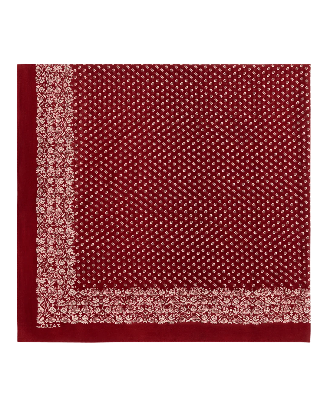 A square red scarf with a dense white micro-dot pattern and ornate borders, displayed flat against a white background.