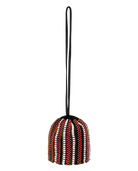 Decorative beaded object with a black handle on a white background
