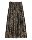 Long black and beige patterned skirt on a white background