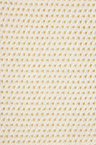 Close-up of a textured beige fabric pattern