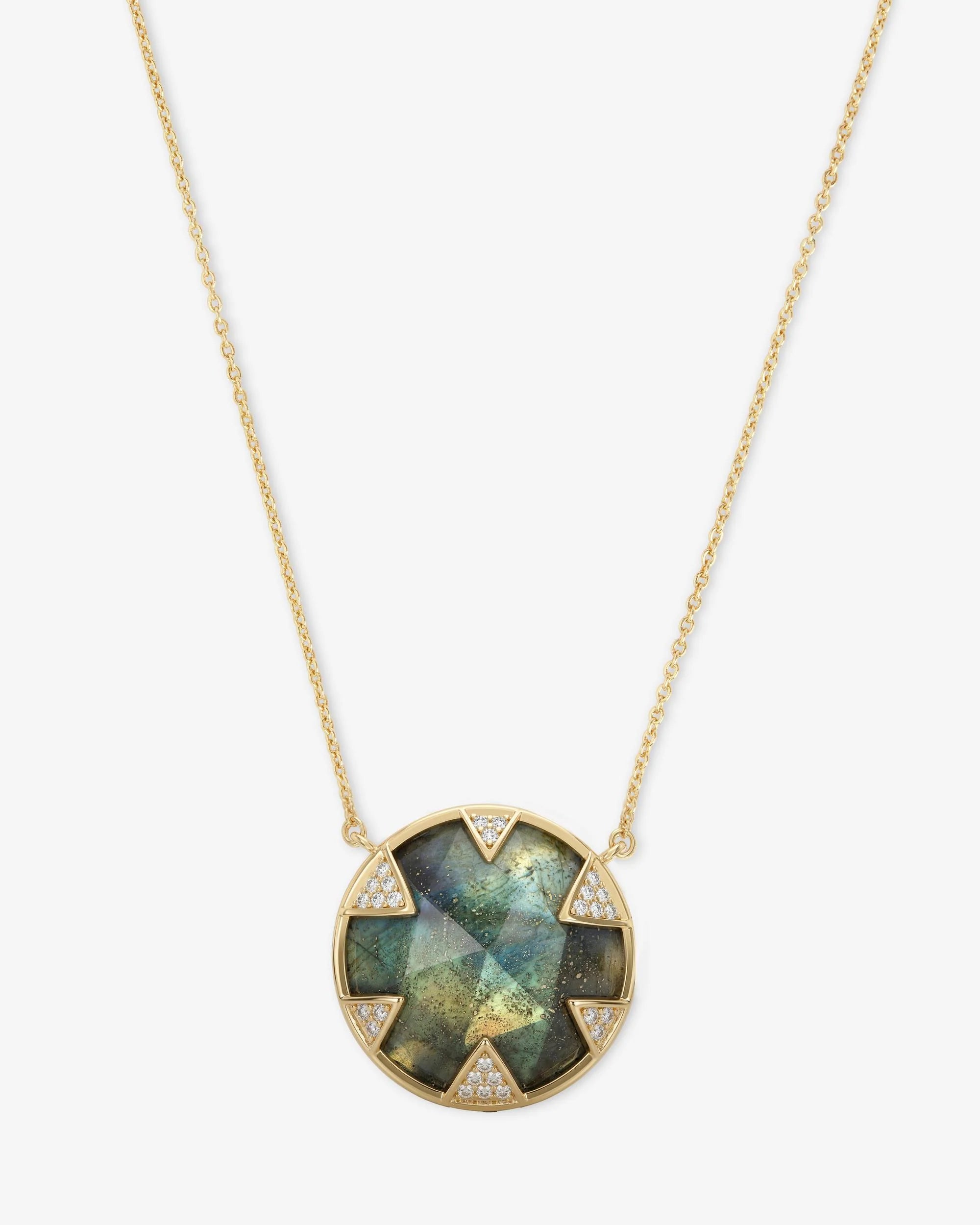 Necklace with a green gemstone pendant on a white background