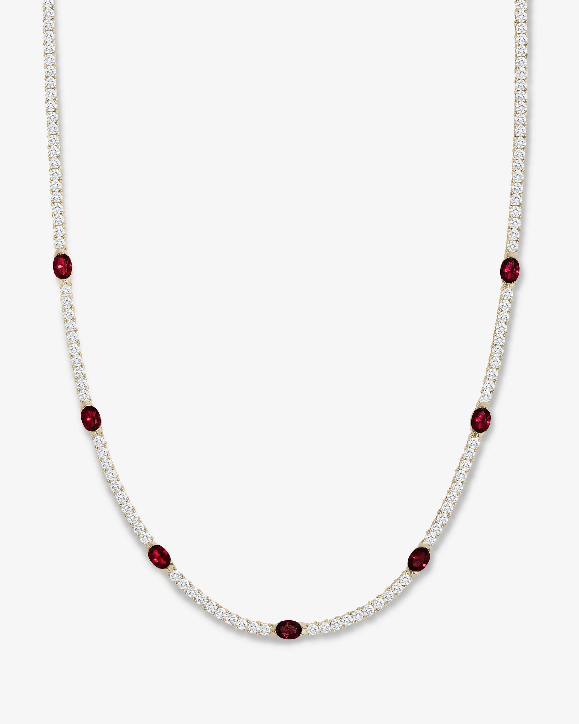 A delicate necklace featuring a double row of small white stones with spaced oval dark red gemstone accents, displayed on a clean light gray background.
