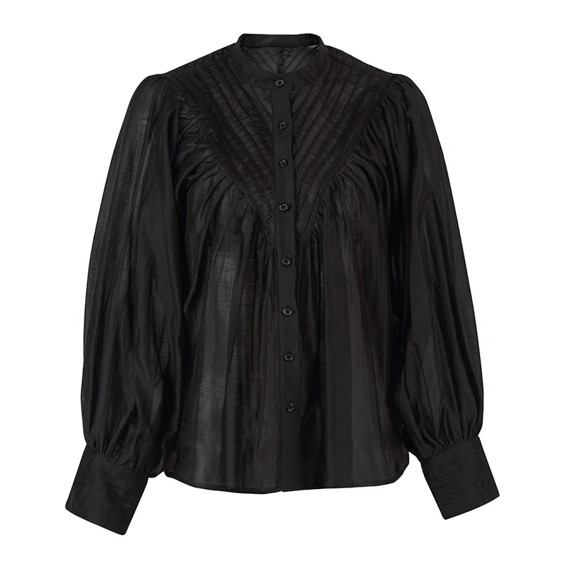 Black blouse with puffed sleeves on a white background