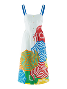 Colorful apron with umbrella pattern hanging on a white background