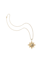 A gold necklace featuring a star-shaped pendant with a textured, layered starburst design and a small central clear gemstone, displayed on a clean white background.