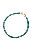 A beaded bracelet featuring dark green malachite beads separated by small gold spacer beads, finished with a gold clasp and a small round gold logo charm, shown on a plain white background.