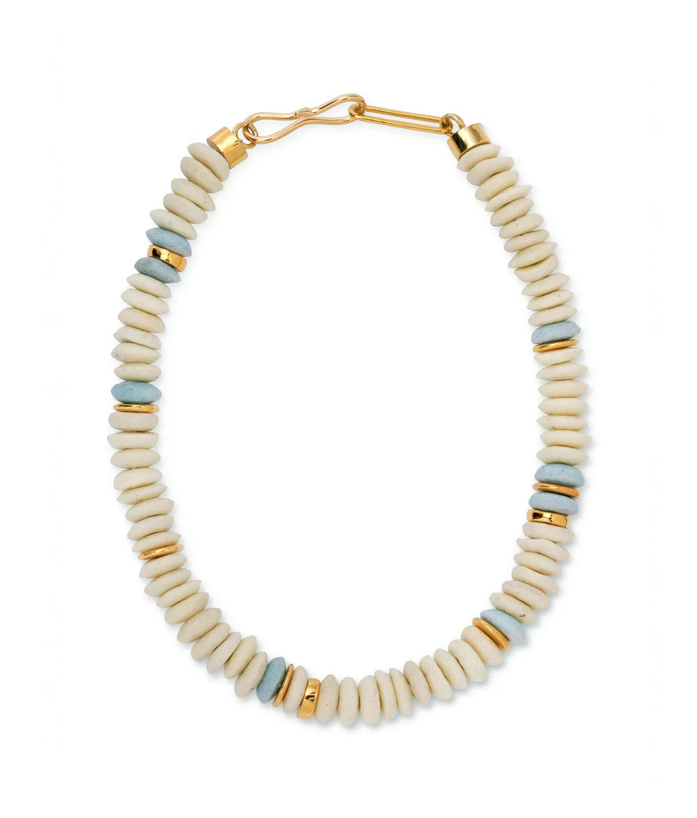 Necklace with beige, gold, and blue beads on a white background
