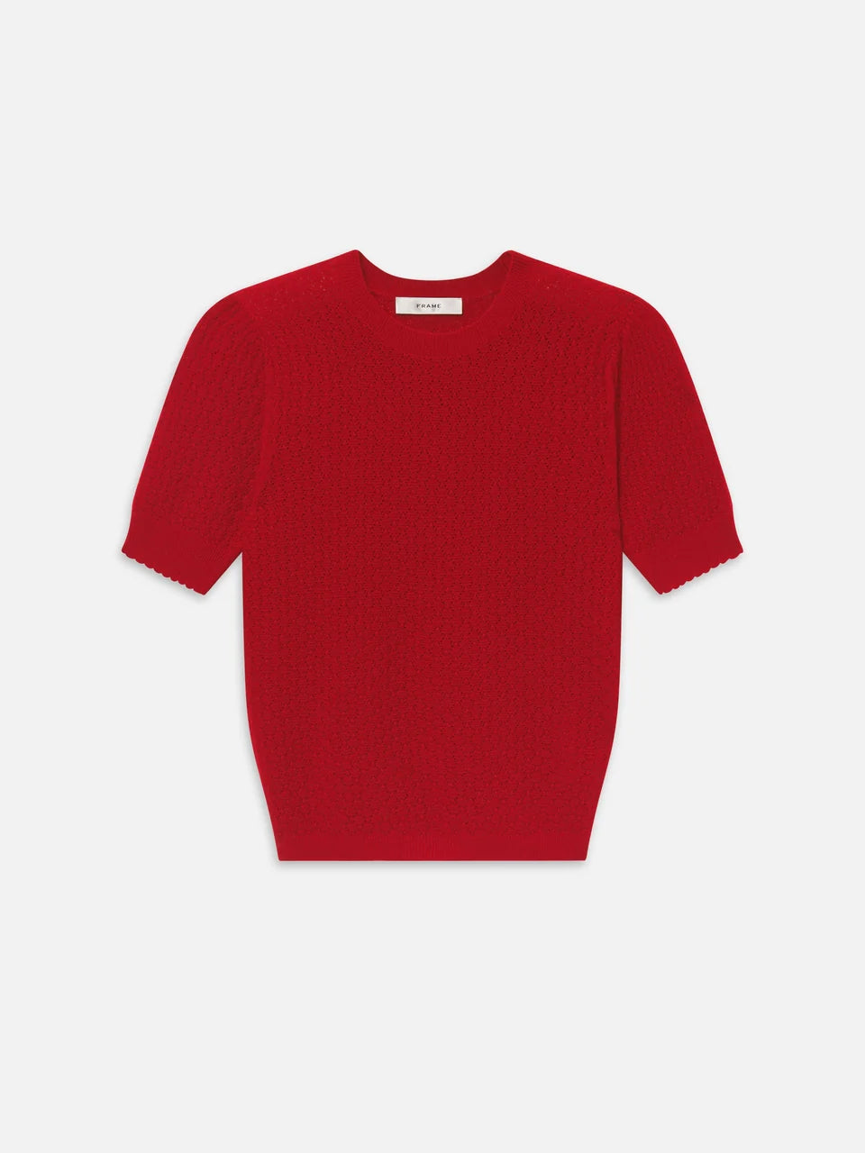 A red short-sleeve knit sweater with a textured cable pattern, displayed flat against a light gray background.