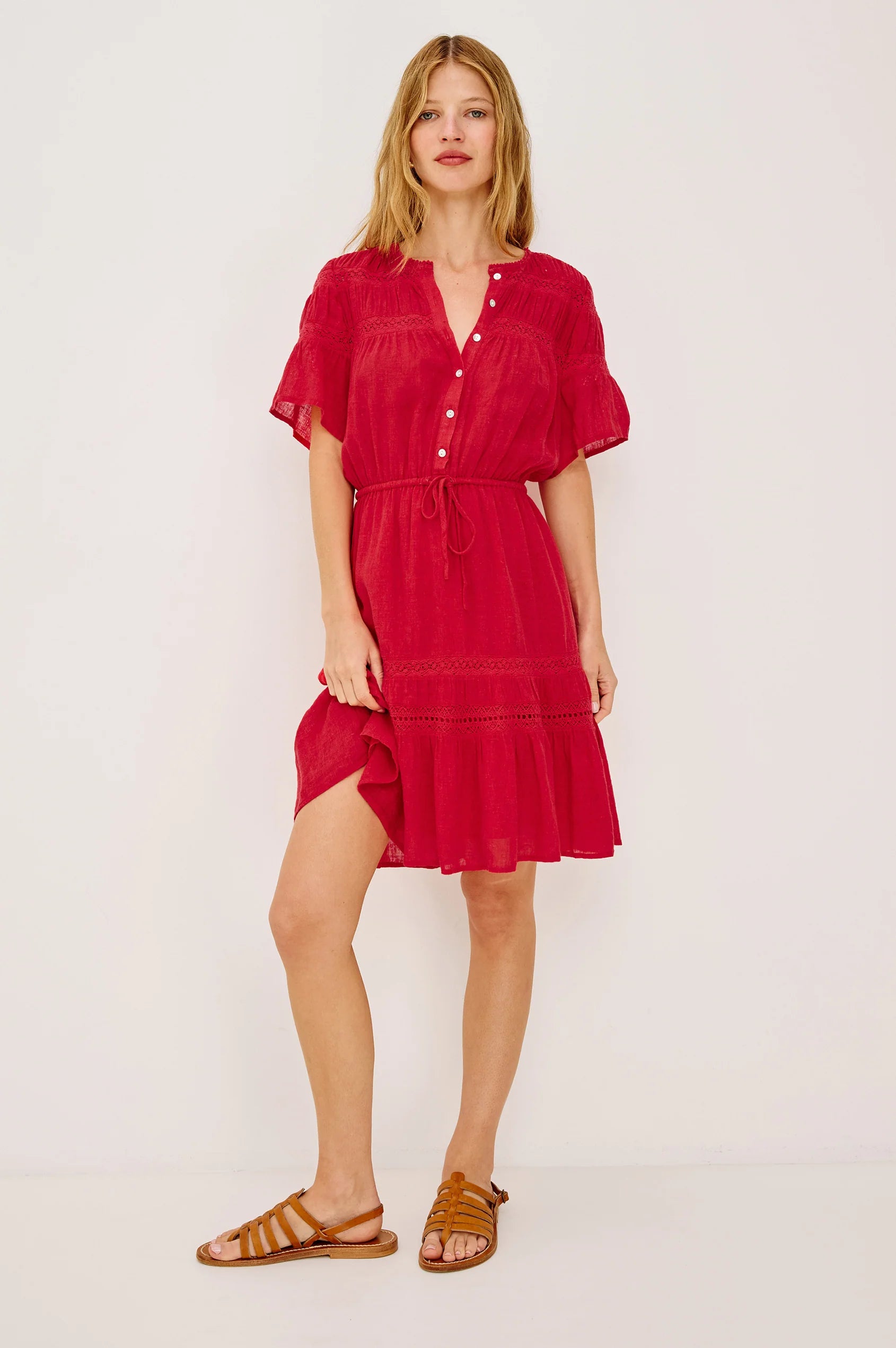 Woman wearing a red dress on a white background