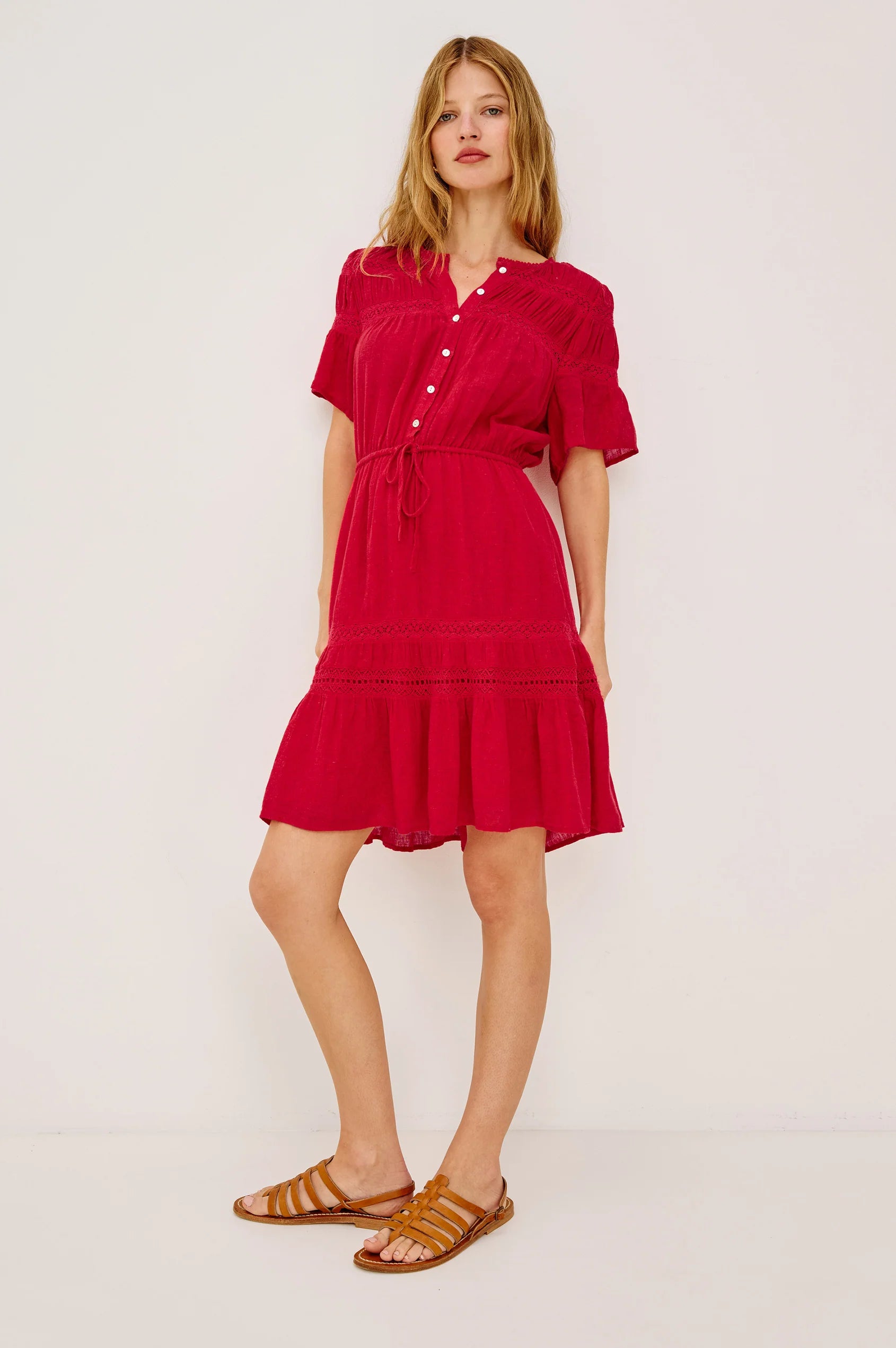 Woman wearing a red dress on a white background