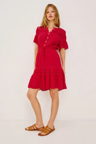 Woman wearing a red dress on a white background