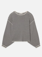 Black and white striped long-sleeve shirt on a light gray background