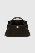 Black handbag with a white logo on a light gray background