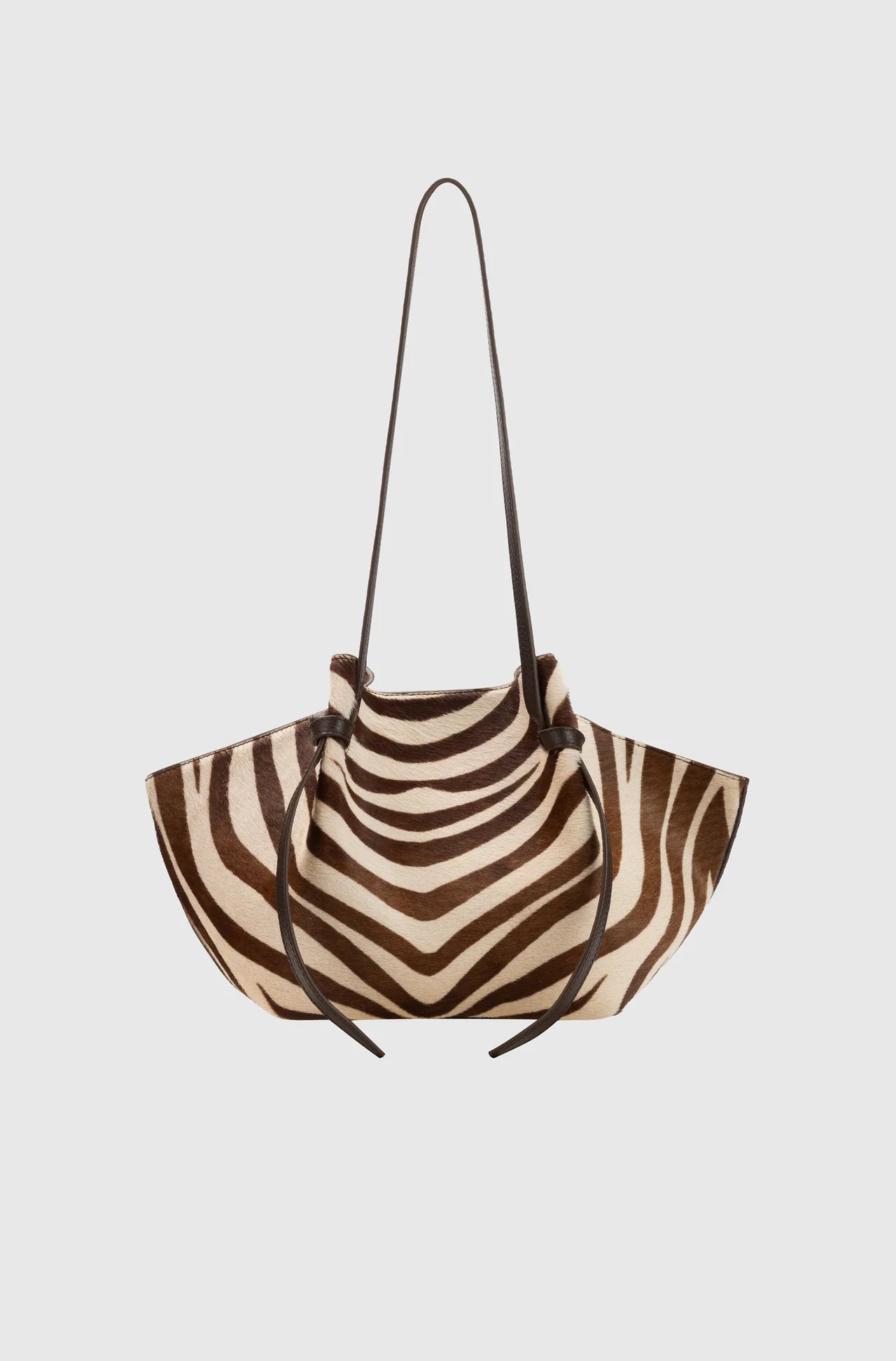 Zebra-striped handbag on a light gray background