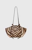 Zebra-striped handbag on a light gray background