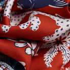 Close-up of patterned fabric with red, white, and blue colors.