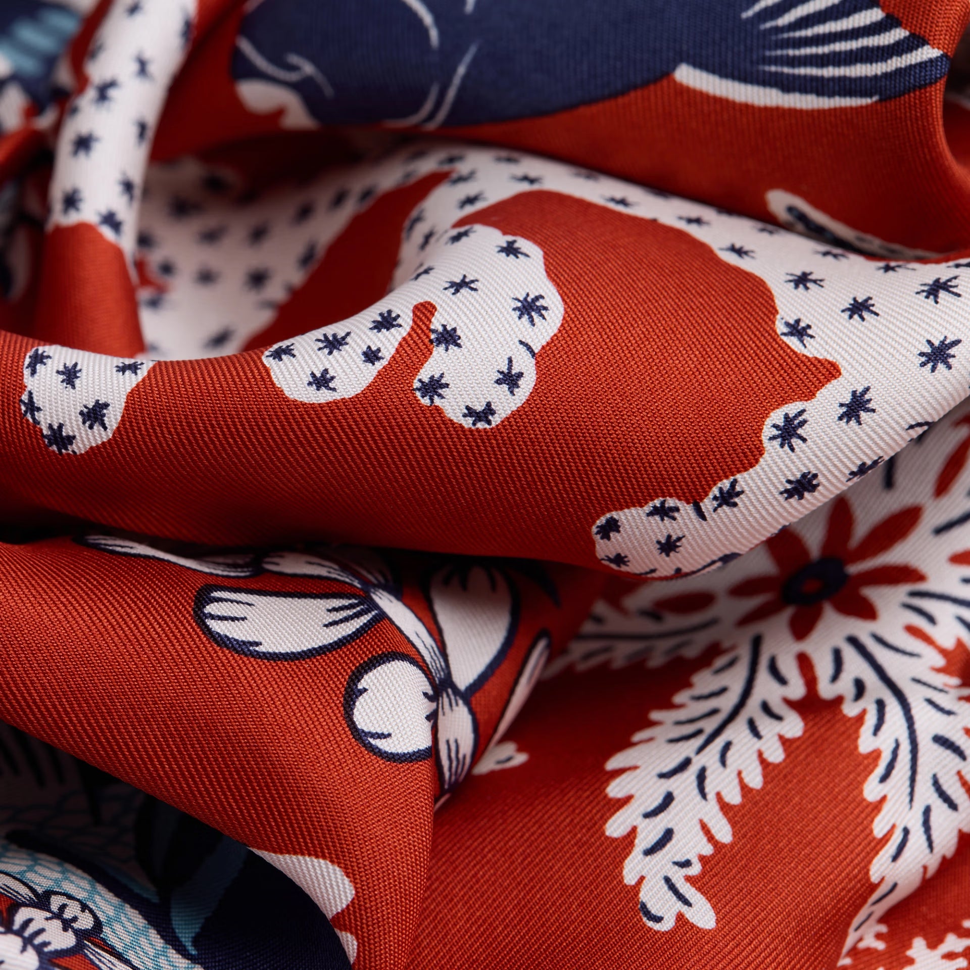Close-up of patterned fabric with red, white, and blue colors.