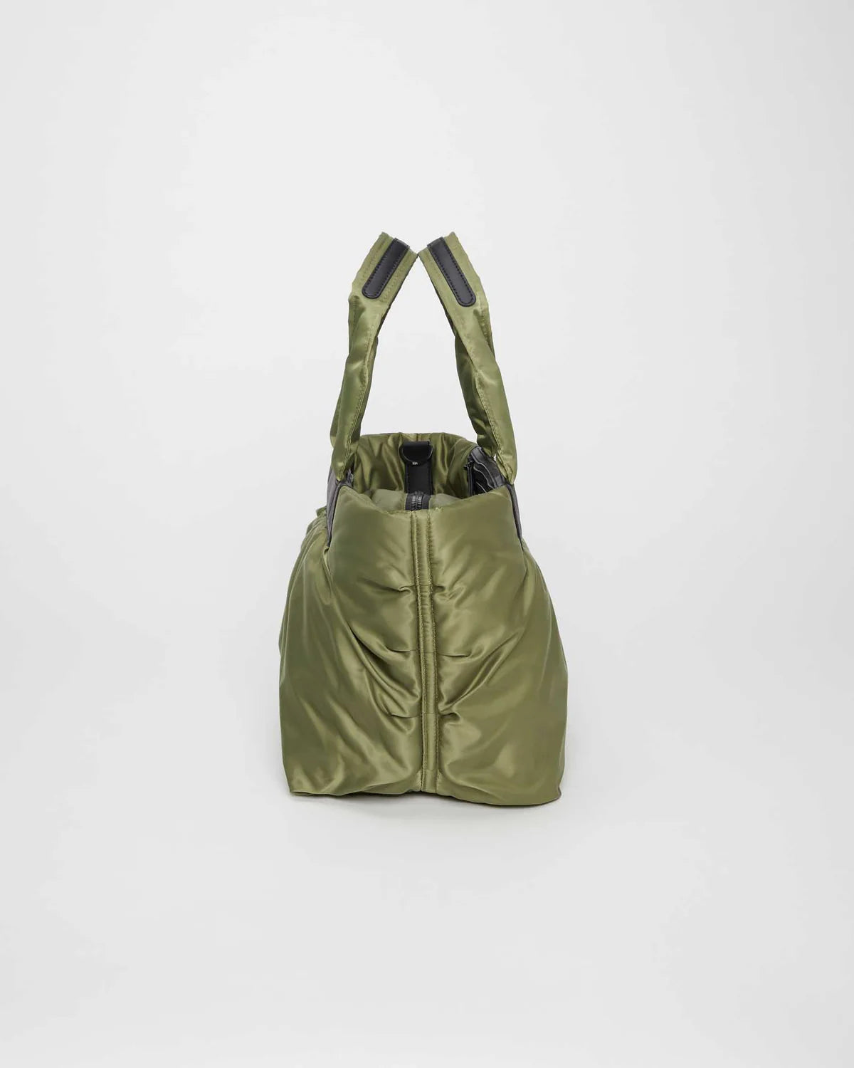 Green backpack with straps on a white background