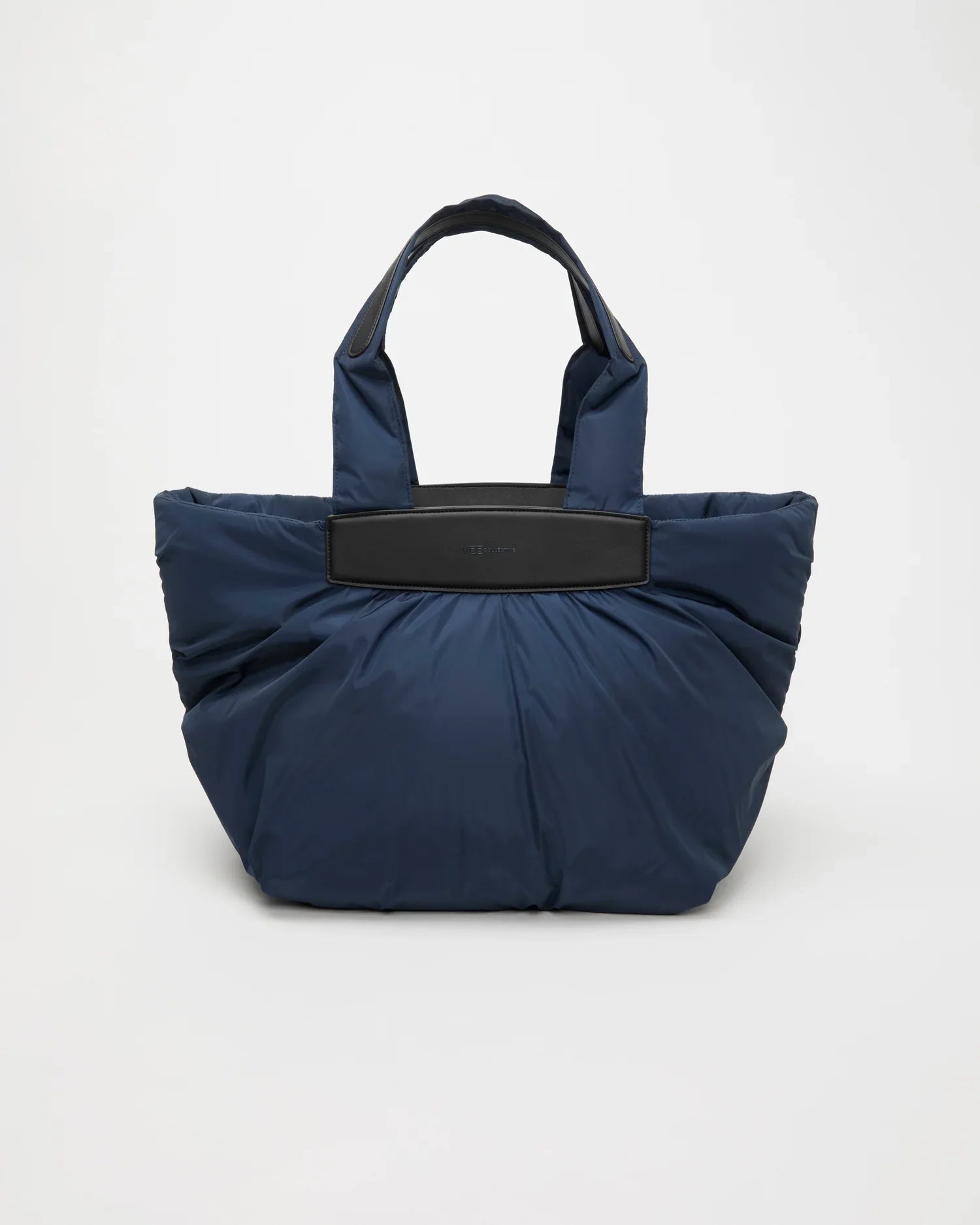Blue tote bag with black handle and trim on a white background