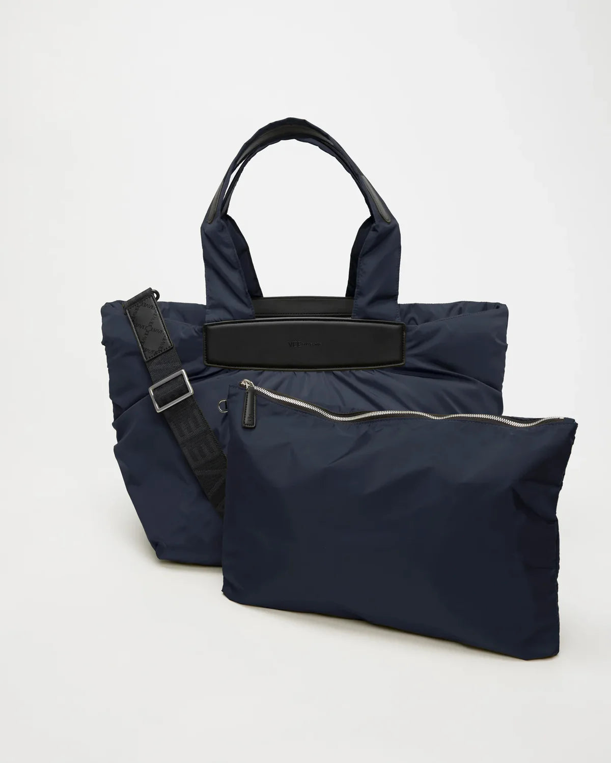 Navy blue bag with a black strap on a white background