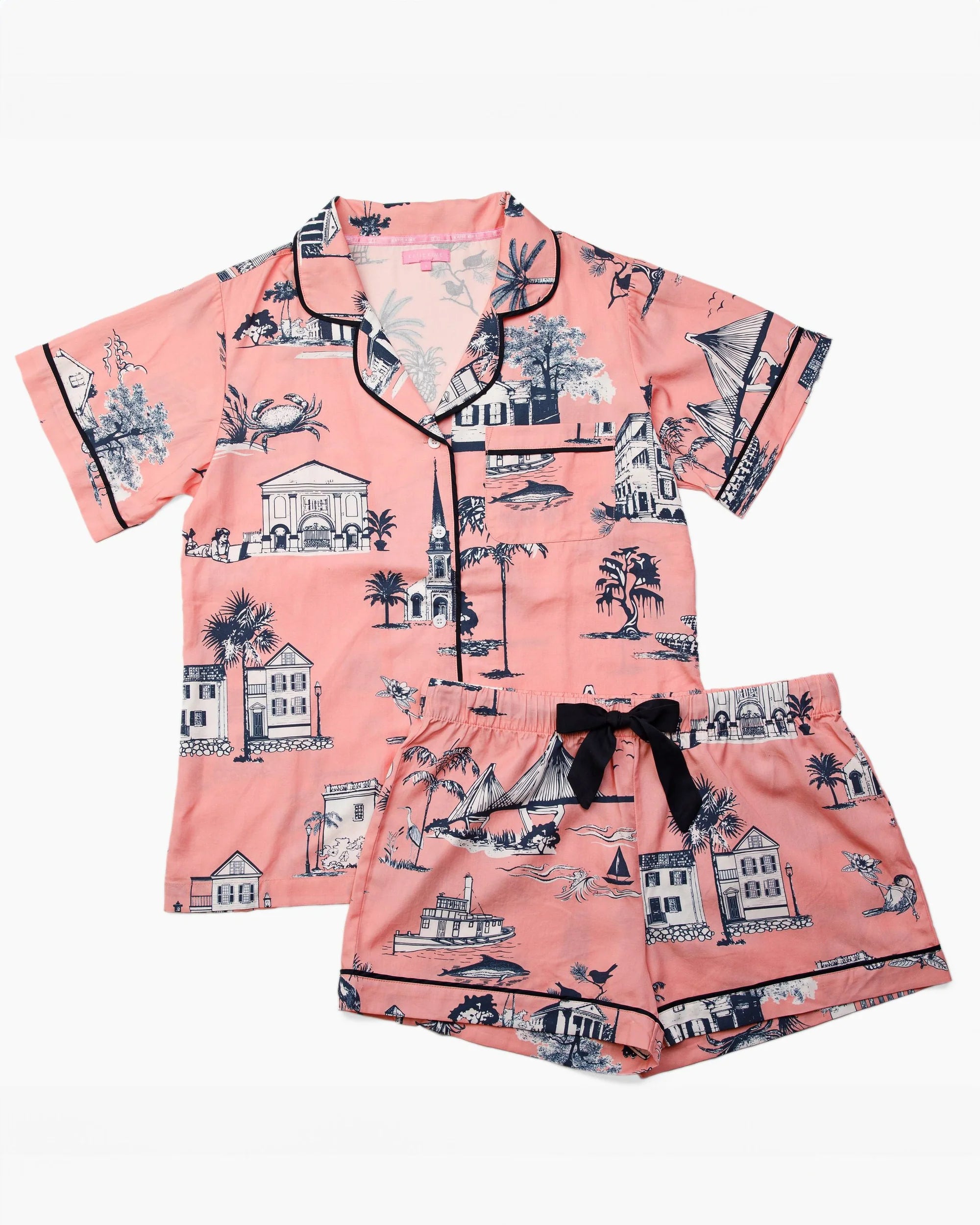 Pink pajama set with black and white pattern on a white background