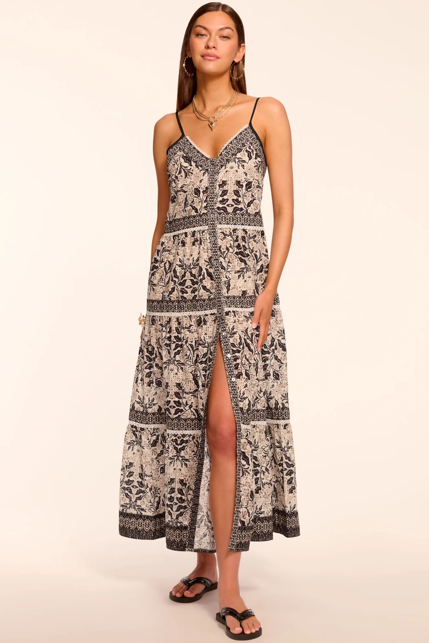 Woman wearing a patterned dress on a beige background
