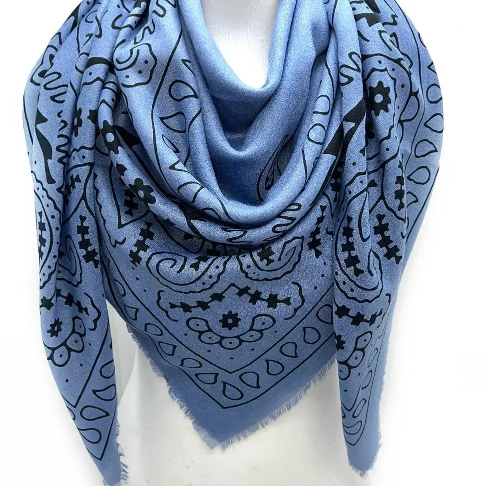 Blue bandana with black patterns on a white background
