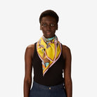 Woman wearing a colorful scarf on a white background
