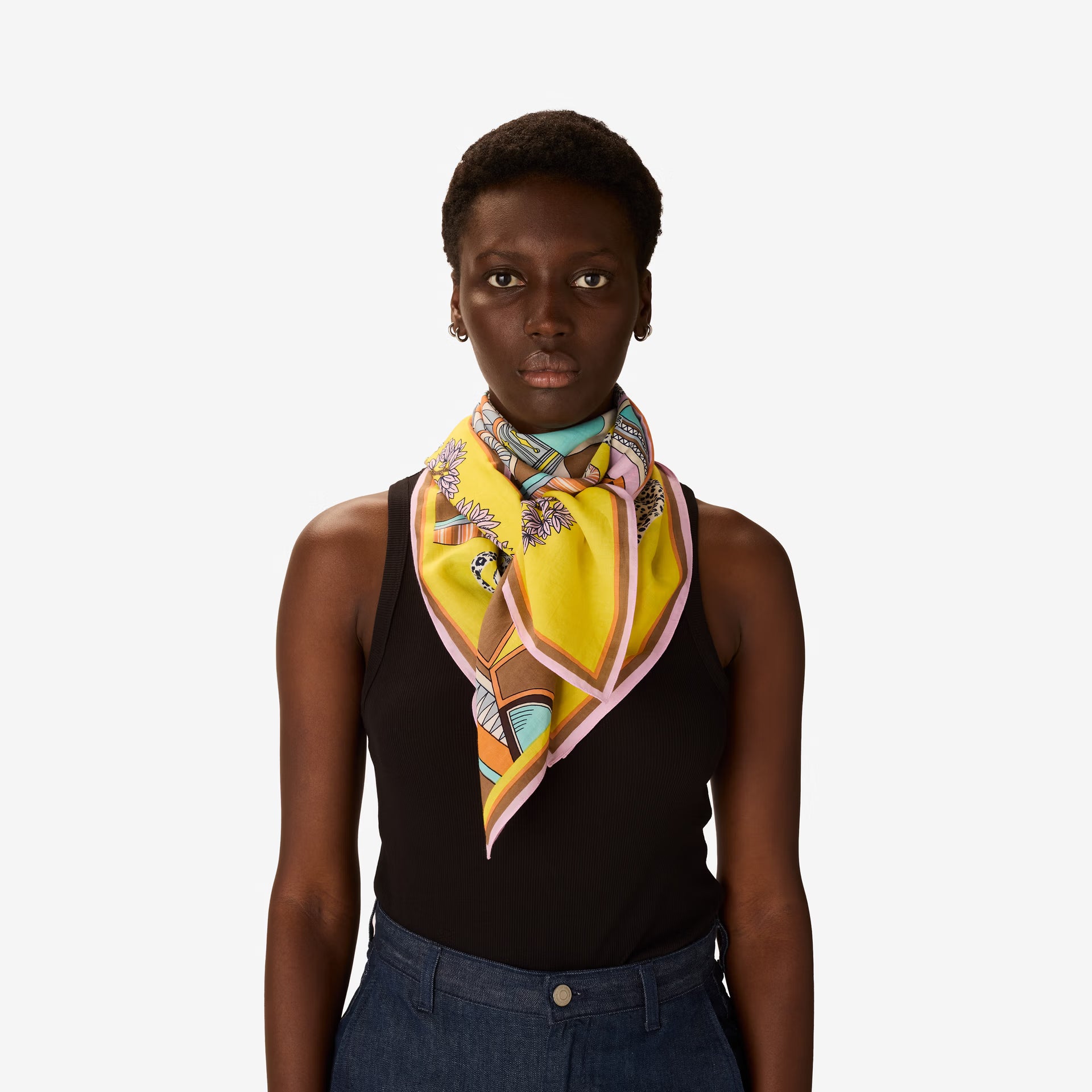 Woman wearing a colorful scarf on a white background
