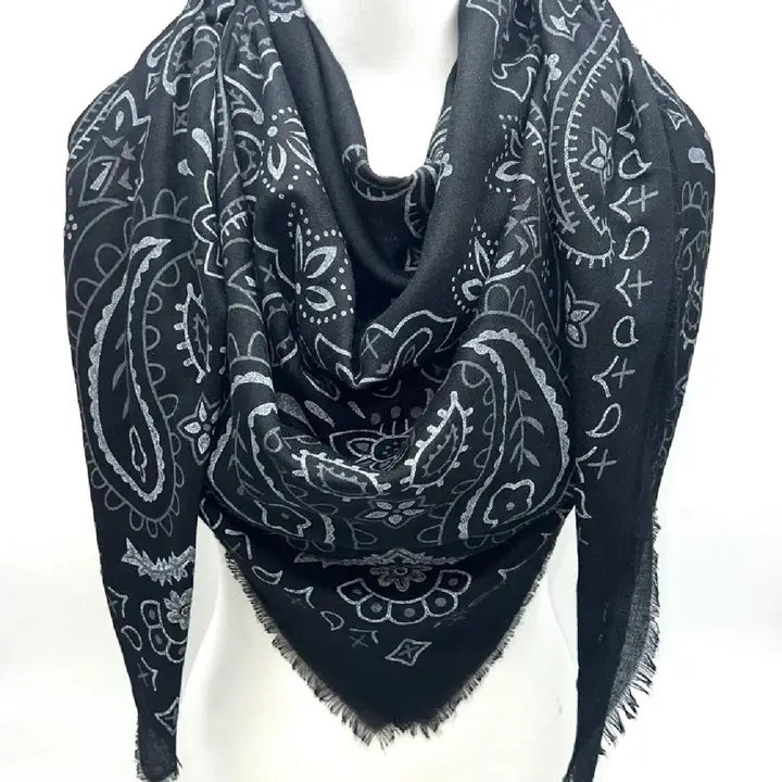 Black paisley patterned scarf on a white mannequin