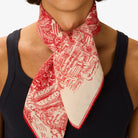 Person wearing a red and white patterned scarf