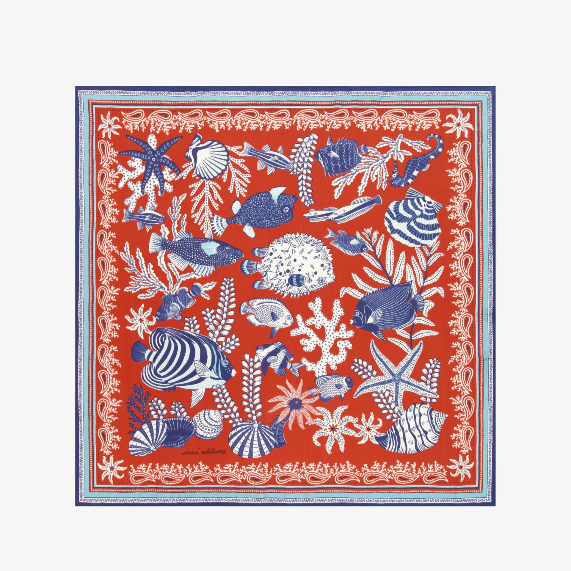 Red scarf with blue and white marine life pattern on a white background
