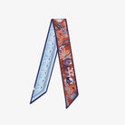 Decorative scarf with blue and orange pattern on a white background