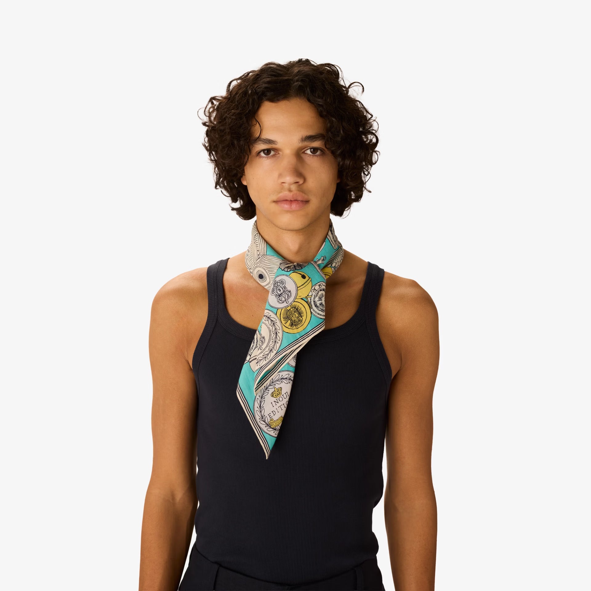 Person wearing a colorful scarf around their neck on a white background