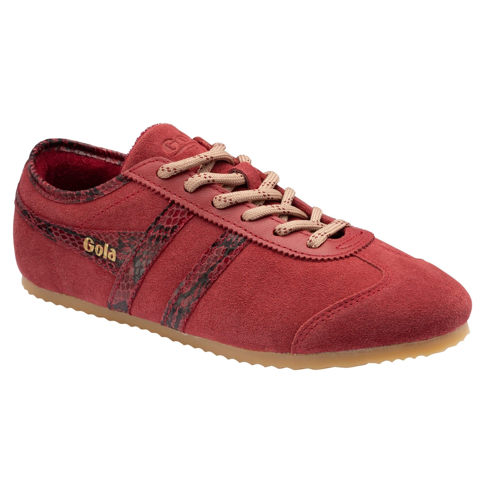 A red suede sneaker with textured snakeskin stripe panels, beige laces, and a gum sole, shown on a plain white background.