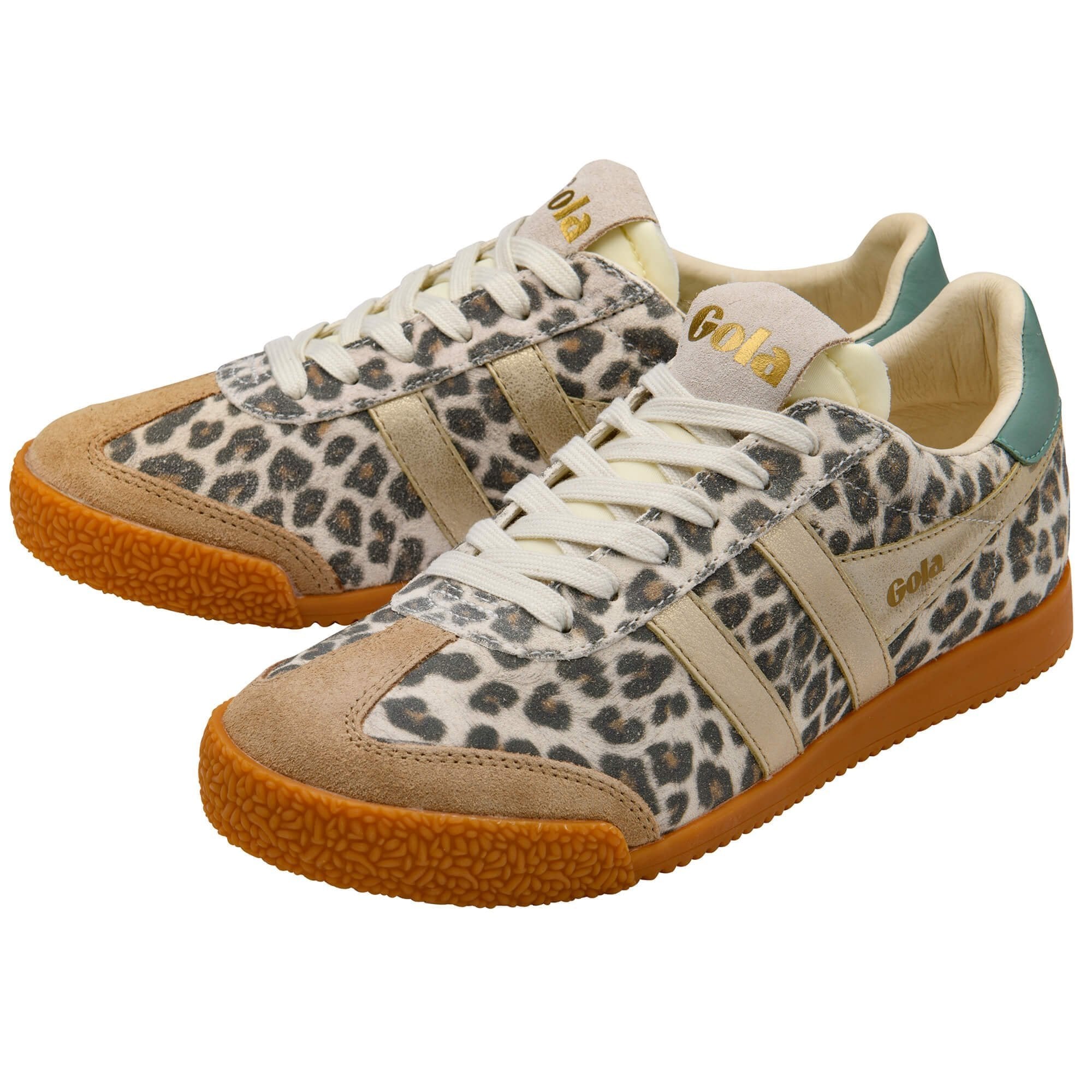 Pair of leopard print sneakers with brown soles on a white background