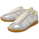 Pair of silver sneakers with white laces and brown soles on a white background