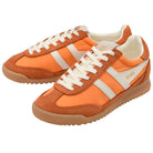 Orange and brown Adidas sneakers with white stripes on a white background