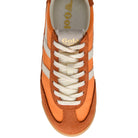 Orange sneaker with white laces on a white background